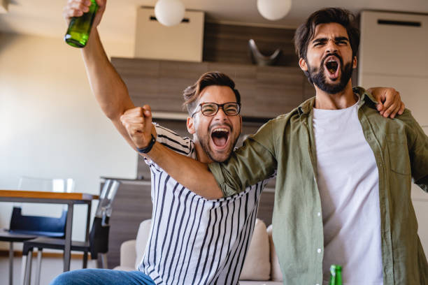 istock Men watch a sports game 1164380822