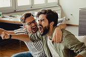 Men watch a sports game