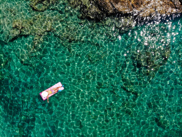 istock Drone image of woman on seabed. 1164384880