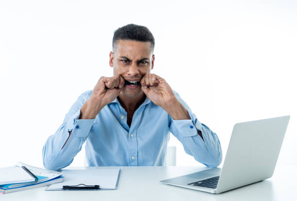 istock Overwhelmed desperate attractive businessman with too much work feeling frustrated and nervous in distress. Overtime overwork deadline and frustration stress at work. Isolate on white background. 1164385740