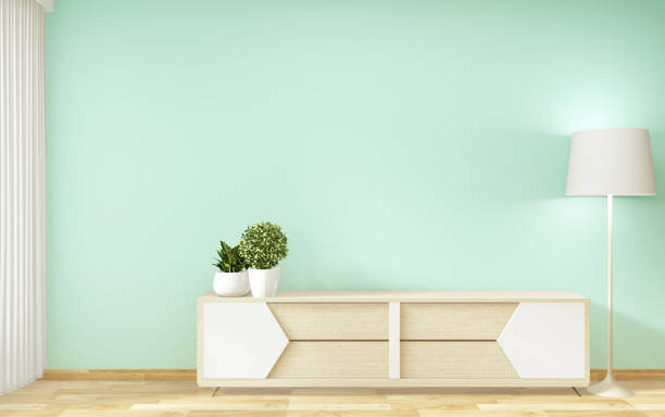 istock Tv shelf in mint room modern tropical style - empty room interior - minimal design. 3d rendering 1164385927