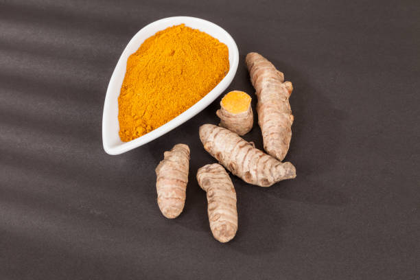 istock Turmeric - Curcuma longa root and turmeric powder 1164386512