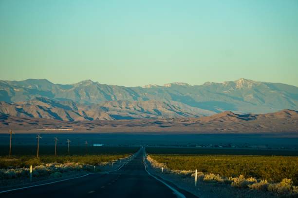 istock valley road leading to mountains 1164387088