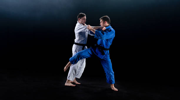 istock Judo Players Competing During Match 1164387256