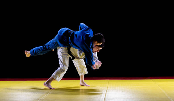 istock Two Female Judo Practitioners Grappling On A Tatami Mat 1164387278