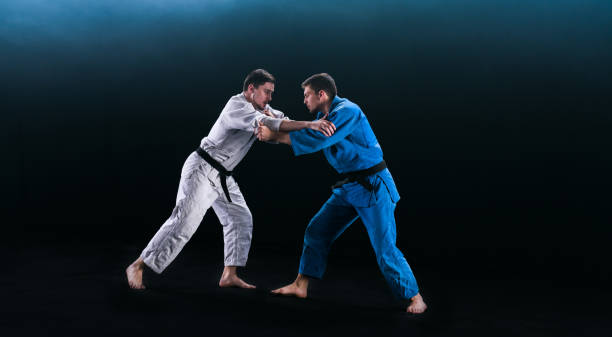 istock Judo Players Competing During Match 1164387280