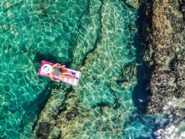istock Drone image of woman on seabed. 1164391499