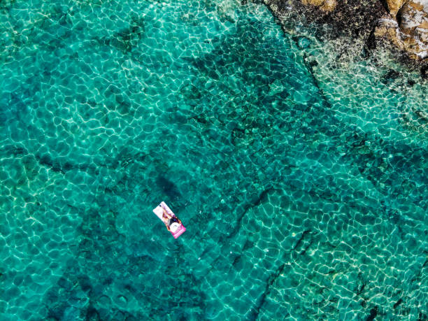 istock Drone image of woman on seabed. 1164392681
