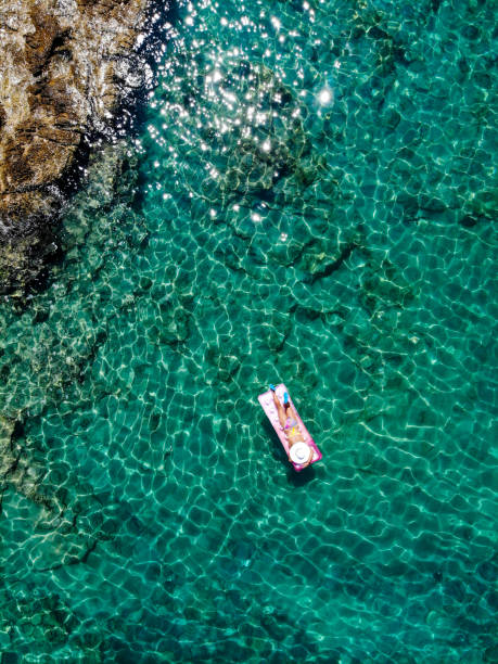 istock Drone image of woman on seabed. 1164395037
