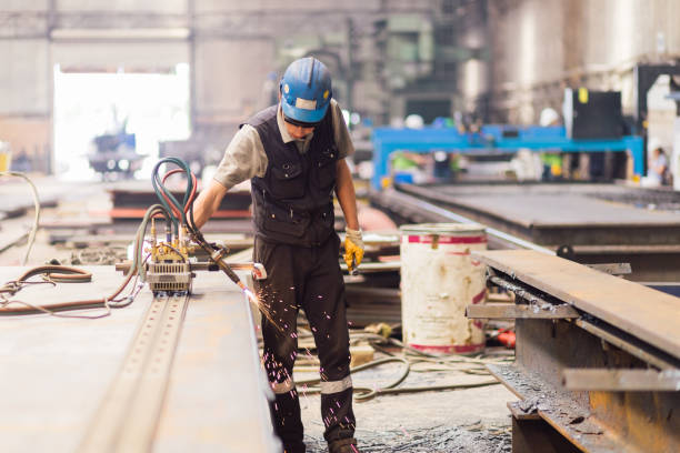 man controls the rail metal cutter