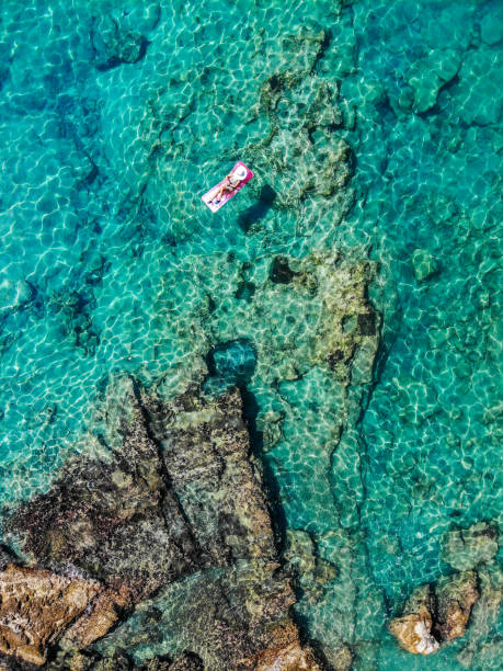 istock Drone image of woman on seabed. 1164397155