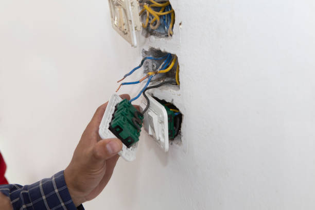 istock Electrician working at plug socket. Repair concept. 1164398393