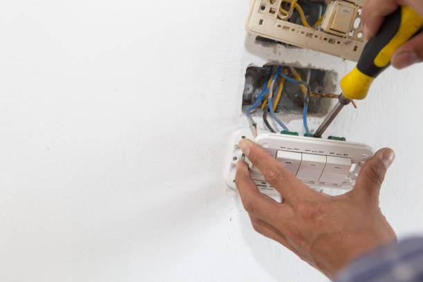 istock Electrician working at plug socket. Repair concept. 1164398396