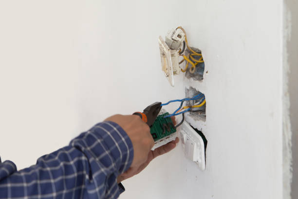 istock Electrician working at plug socket. Repair concept. 1164398403