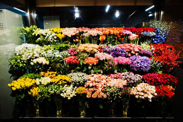istock Fllower shop with colourful flowers at supermaket. 1164399559