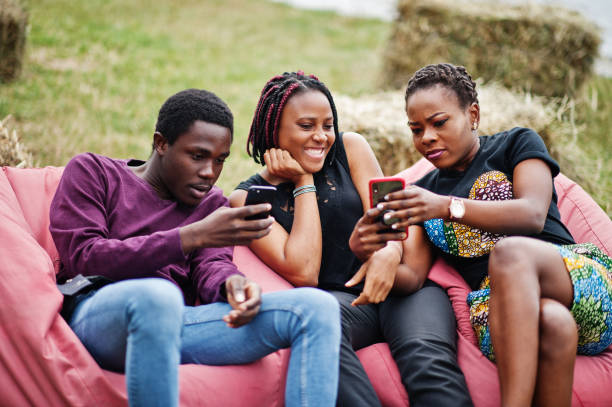 istock Three african american friends having fun together. 1164399658