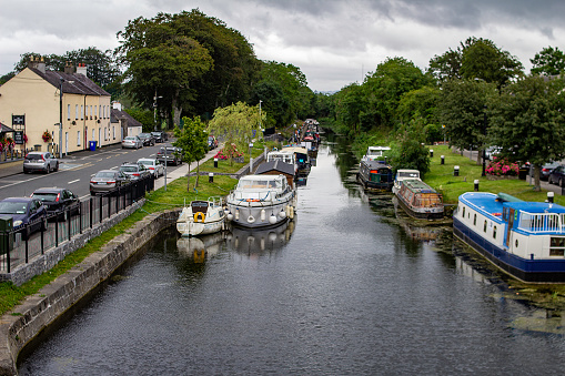 The 13th lock of the Grand Canal, in Sallins, County Kildare, Ireland, with canal houseboats berthed on either side.