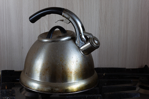 Dirty teapot on the stove