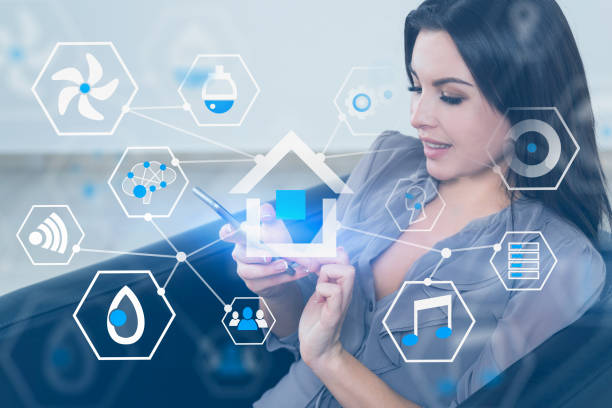 istock Woman in armchair, smart home interface 1164402590