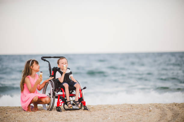 Brother and sister eating an ice cream stock photo