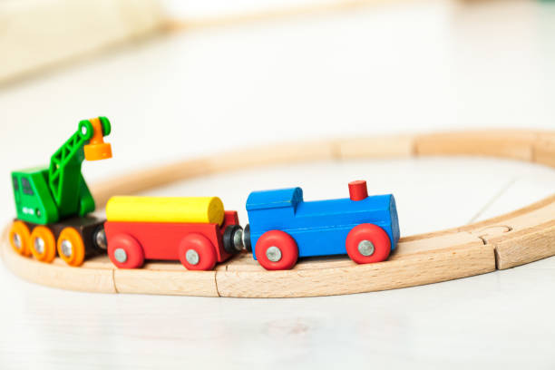 istock Child's wooden train on the white floor 1164412384