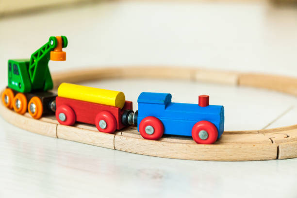istock Child'd wooden train on the white floor 1164412392