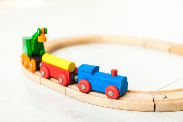 istock Child's wooden train on the white floor 1164412398