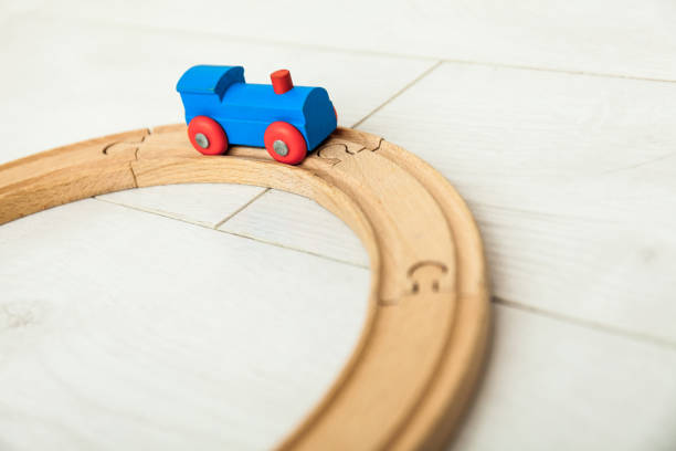 istock Child's wooden train on the white floor 1164412427