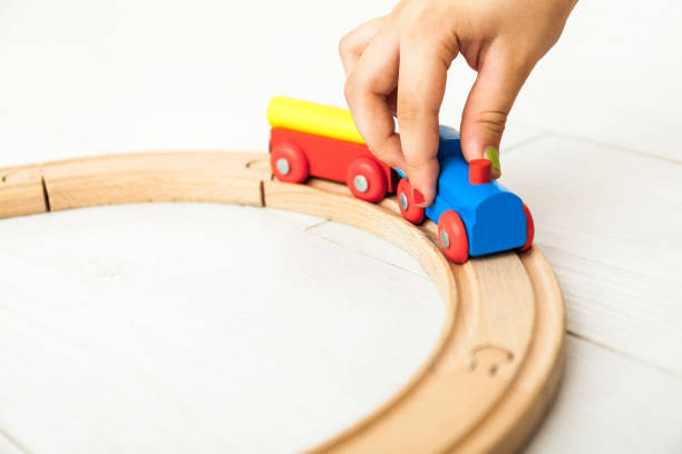 istock Child's wooden train on the white floor 1164412446