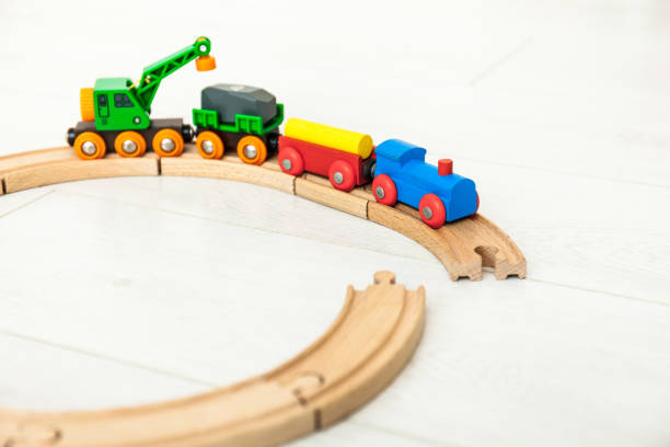 istock Child's wooden train on the white floor 1164412502