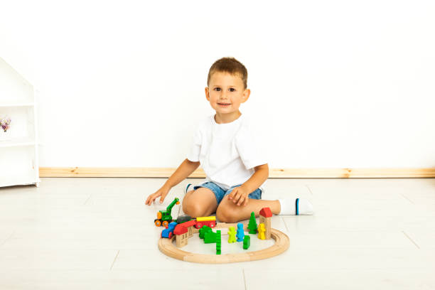 istock Boy playing with toys indoors at home 1164412685