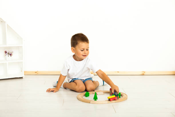 istock Boy playing with toys indoors at home 1164412698