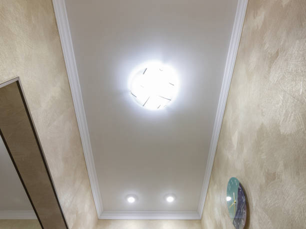 istock Fragment of a false ceiling in a long corridor 1164417724