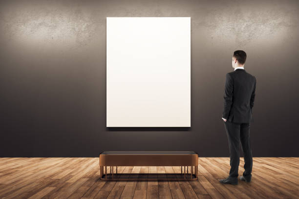 Businessman looking at poster