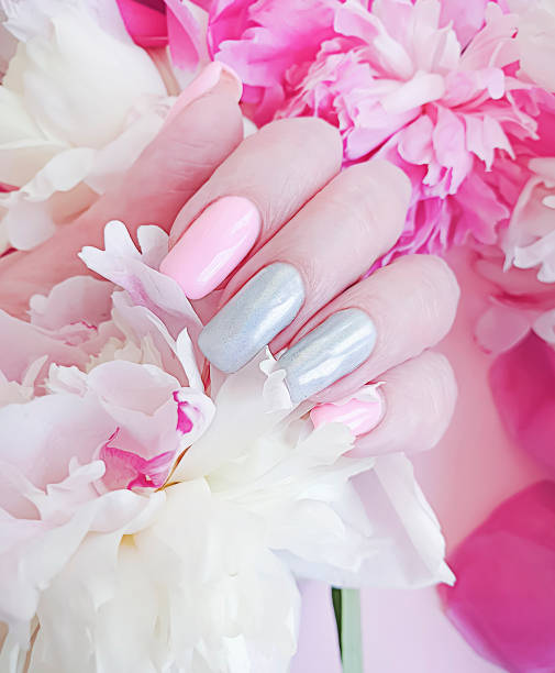 istock female hand manicure flower peony 1164421457