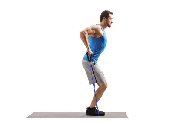 istock Young muscular man exercising with a resistance band 1164426240