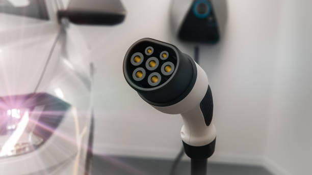 istock Electric Car charging station plug in garage 1164426270