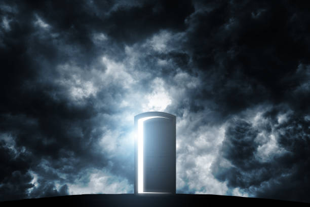Silhouette of Door opened light with cloudy sky