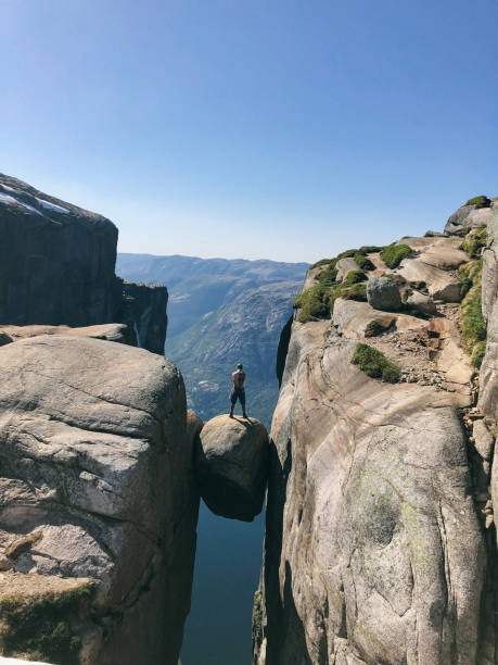 istock Hiker standing on Kjeragbolten in Norway 1164435713