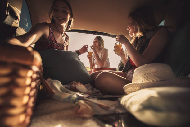 istock Girlfriends enjoying refreshing beverages while making a stop on their road trip 1164435836