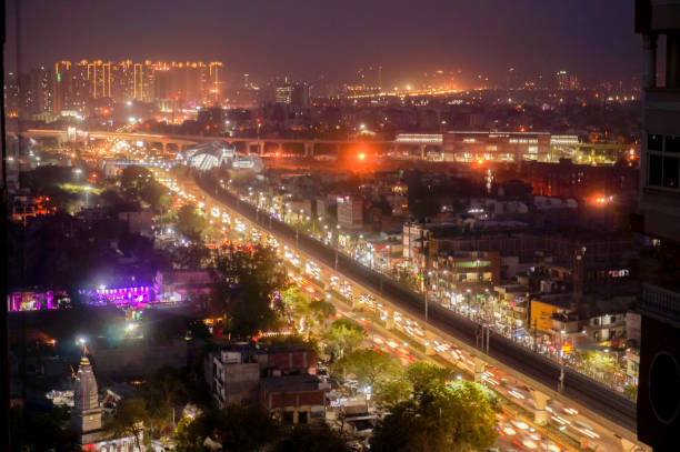 aerial stadsbilden skott av noida, delhi, grugaon i skymningen natt - haryana bildbanksfoton och bilder