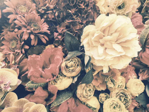 istock artificial flowers wall background with vintage style 1164436161