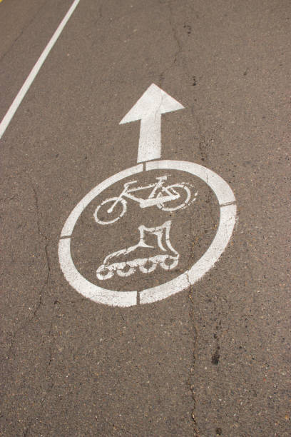 istock Sign of a Bicycle path and rollers on asphalt 1164449947