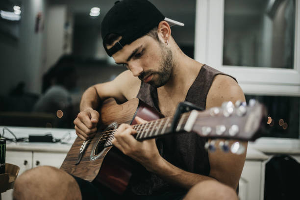 istock A handsome man enjoys his guitar 1164451043