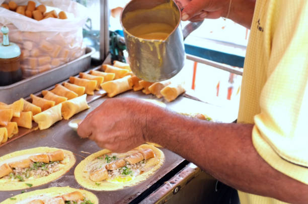 istock The man cooking Soft Waffle ,  Roll pancake stuffed with pork with custard and eeg 1164451914