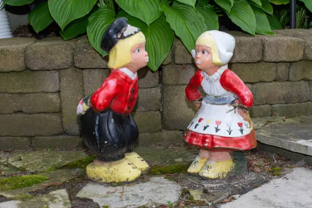 Photo of Dutch Lawn ornaments of two traditional dutch kids in clothing from Holland in the Netherlands.