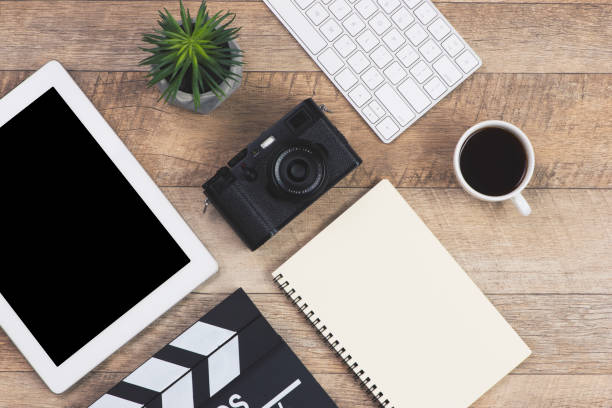 istock Screenwriter workplace with wooden table. Top view 1164457115