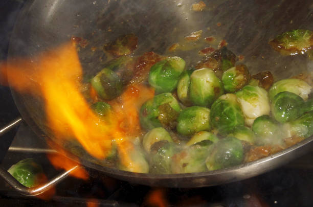 fresh brussels sprouts sauteed in olive oil - brusselsprouts imagens e fotografias de stock