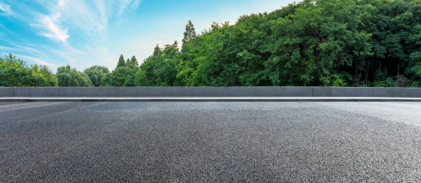 istock Asphalt highway and green forest with beautiful clouds landscape 1164460183