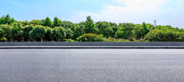 istock Asphalt highway and green forest with beautiful clouds landscape 1164460277